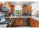 Stylish kitchen with a gas range, custom tile work, and plenty of counter space, designed for efficient cooking at 5955 Ferendina St, North Port, FL 34291