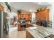 Charming kitchen boasting ample storage, stainless steel appliances, and a breakfast bar, perfect for culinary enthusiasts at 5955 Ferendina St, North Port, FL 34291