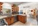 Well-appointed kitchen featuring custom cabinetry, tile backsplash, and modern appliances, blending style and functionality at 5955 Ferendina St, North Port, FL 34291