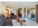 Comfortable living area with sliding glass doors that fill the space with light at 5955 Ferendina St, North Port, FL 34291