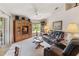 Inviting living room featuring an entertainment center and cozy seating area at 5955 Ferendina St, North Port, FL 34291