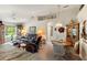 Comfortable living room featuring leather recliners, large windows, and access to the dining area, creating a welcoming space at 5955 Ferendina St, North Port, FL 34291