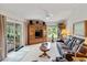 Comfortable living room with an entertainment center and bright natural light at 5955 Ferendina St, North Port, FL 34291