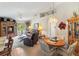 Cozy living room featuring an entertainment center and bright natural light at 5955 Ferendina St, North Port, FL 34291