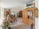 Spacious living room showcases a large wooden cabinet, plush seating, and elegant decor, creating a cozy atmosphere at 5955 Ferendina St, North Port, FL 34291