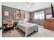 Stylish bedroom featuring gray walls, unique wall decor, and a sleek desk area, perfect for a modern living space at 6013 Murdock Ave, Sarasota, FL 34231