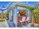 Charming cabana with a bar, TV, and decorative fish art, perfect for entertaining at 6013 Murdock Ave, Sarasota, FL 34231