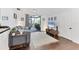 Cozy living room with a sliding door to the porch, contemporary furniture, and hardwood floors at 6013 Murdock Ave, Sarasota, FL 34231