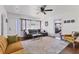Inviting living room with comfortable seating, hardwood floors, and lots of natural light at 6013 Murdock Ave, Sarasota, FL 34231
