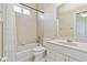 Bathroom featuring a white tile shower, a toilet, and a vanity at 6110 Misty Oaks St, Sarasota, FL 34243