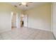 Bedroom featuring tile floors, and doors leading to other rooms at 6110 Misty Oaks St, Sarasota, FL 34243