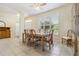 The dining room features tile floors, plantation shutters, and a ceiling fan at 6110 Misty Oaks St, Sarasota, FL 34243
