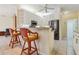 Bright kitchen with white cabinets, stainless steel appliances, and a breakfast bar at 6110 Misty Oaks St, Sarasota, FL 34243