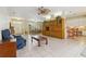 The open floor plan connects the living room, dining room, and kitchen, perfect for entertaining at 6110 Misty Oaks St, Sarasota, FL 34243