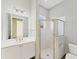 Modern bathroom showcasing a glass shower enclosure, white vanity, and chrome finishes at 6520 38Th E Ln, Sarasota, FL 34243