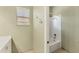 Bathroom featuring a tub with shower and hooks on the wall at 6520 38Th E Ln, Sarasota, FL 34243