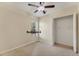 Cozy bedroom featuring carpeted floors, a ceiling fan, and an open closet at 6520 38Th E Ln, Sarasota, FL 34243