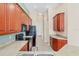 Spacious kitchen with warm cabinetry, plenty of counter space and tile flooring at 6520 38Th E Ln, Sarasota, FL 34243