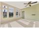 This spacious living room features neutral walls and carpet with a beautiful view of the lake at 6520 38Th E Ln, Sarasota, FL 34243