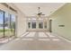 This spacious living room features neutral walls and carpet with a beautiful view of the lake at 6520 38Th E Ln, Sarasota, FL 34243