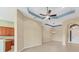 Inviting living space with tiled floors connecting to the kitchen and front entryway at 6520 38Th E Ln, Sarasota, FL 34243