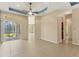 Bright open living area with tile floors and access to the lanai through sliding glass doors at 6520 38Th E Ln, Sarasota, FL 34243