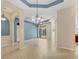 Open living room with tile flooring and sliding glass doors leading to the outdoors at 6520 38Th E Ln, Sarasota, FL 34243