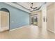 Open-concept living room with large windows and sliding doors for natural light at 6520 38Th E Ln, Sarasota, FL 34243