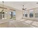 This spacious living room features neutral walls and carpet with a beautiful view of the lake at 6520 38Th E Ln, Sarasota, FL 34243