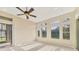 This spacious living room features neutral walls and carpet with a beautiful view of the lake at 6520 38Th E Ln, Sarasota, FL 34243