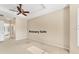 This spacious main bedroom features neutral walls and carpet with large windows to let the sunlight in at 6520 38Th E Ln, Sarasota, FL 34243