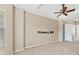 This spacious main bedroom features neutral walls and carpet with access to the main bathroom at 6520 38Th E Ln, Sarasota, FL 34243