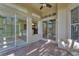 Covered patio with sliding glass doors offering seamless indoor-outdoor living at 6520 38Th E Ln, Sarasota, FL 34243