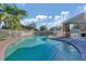 Community pool with sparkling water and a covered pavilion for shade and comfort at 6520 38Th E Ln, Sarasota, FL 34243