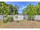 Backyard features a storage shed and a wood privacy fence for added security at 6611 2Nd Ne Ave, Bradenton, FL 34208
