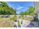 Spacious backyard offers a concrete patio, green lawn, and a privacy fence at 6611 2Nd Ne Ave, Bradenton, FL 34208