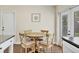 Eat-in kitchen with a round wooden table and four chairs at 6611 2Nd Ne Ave, Bradenton, FL 34208