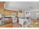 Bright kitchen featuring an island with a stainless countertop and light wood cabinets at 6611 2Nd Ne Ave, Bradenton, FL 34208