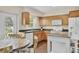 Kitchen boasts stainless sink, white appliances and wood cabinets at 6611 2Nd Ne Ave, Bradenton, FL 34208