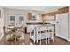 The kitchen boasts white cabinets, a center island, stainless appliances, and a cozy breakfast nook at 6611 2Nd Ne Ave, Bradenton, FL 34208
