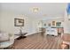 Laminate flooring and an open layout to the kitchen create a spacious living area at 6611 2Nd Ne Ave, Bradenton, FL 34208