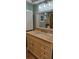 Bathroom vanity features an undermount sink, granite countertop, and a framed mirror at 6902 11Th W Ave, Bradenton, FL 34209