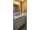 Bright bathroom featuring a vanity with drawers and an undermount sink with granite countertop at 6902 11Th W Ave, Bradenton, FL 34209