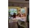Cozy dining area featuring wicker chairs and sunroom view at 6902 11Th W Ave, Bradenton, FL 34209