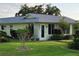 Charming single-story home with a well-manicured lawn and inviting front entrance at 6902 11Th W Ave, Bradenton, FL 34209