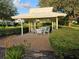 Inviting gazebo with garden views offering a relaxing spot for outdoor gatherings in the community at 6902 11Th W Ave, Bradenton, FL 34209