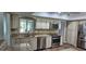Bright kitchen featuring stone countertops and stainless steel appliances at 6902 11Th W Ave, Bradenton, FL 34209