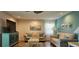 Bright living room featuring comfortable seating and coastal-themed decor at 6902 11Th W Ave, Bradenton, FL 34209