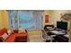 Home office with modern desk setup, and comfortable seating area by the window at 6902 11Th W Ave, Bradenton, FL 34209