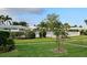 Community pool area with manicured landscaping providing an inviting atmosphere for residents at 6902 11Th W Ave, Bradenton, FL 34209